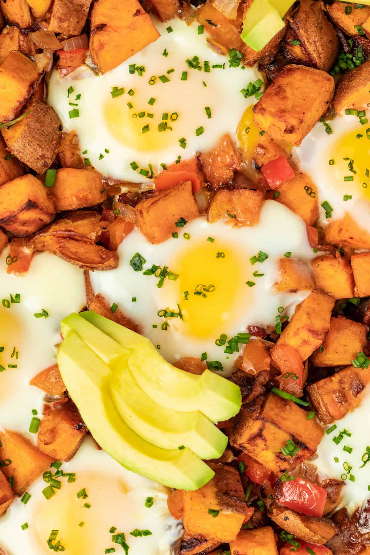 Sweet potato hash with sliced avocado. 