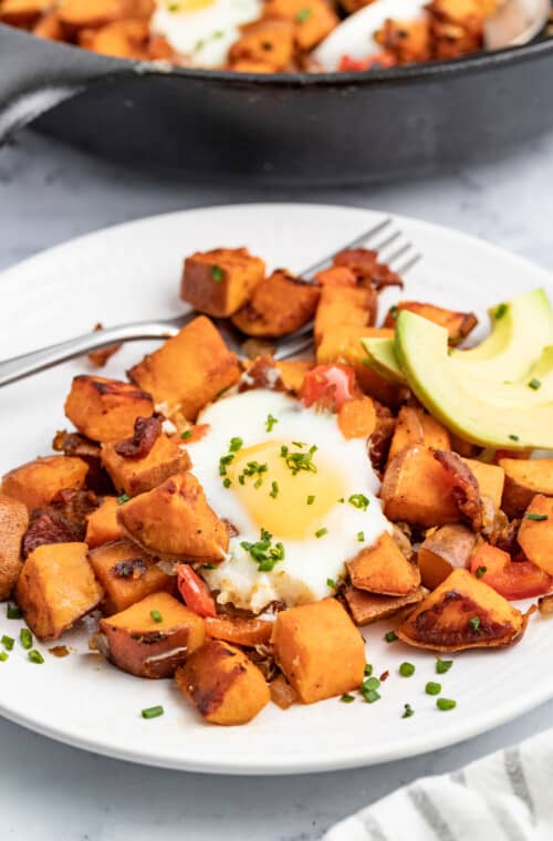 Sweet potato hash with an egg and avocado.