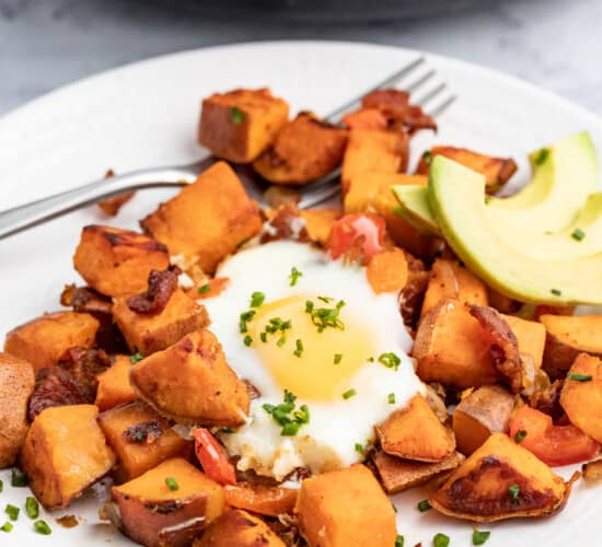 Sweet potato hash with an egg and avocado.