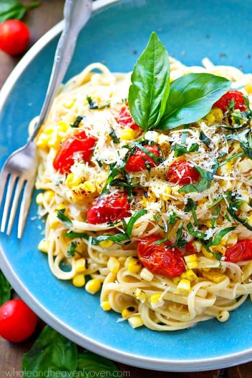 A Aqua Blue Plate of Summer Fettuccine Alfredo with a Fork