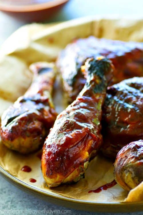 The secret to the best homemade BBQ chicken? Made-from-scratch BBQ sauce and lots of it! This grilled chicken is smothered with tons of flavorful sauce, beautifully smoky, and is the absolute quintessential cookout chicken!