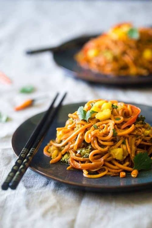 Two Navy Blue Plates with Coconut Curry and Two Sets of Chopsticks