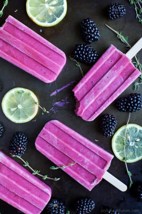 Blackberry Thyme Yogurt Popsicles, a frozen treat that will make your taste buds dance with excitement! Less than 5 minutes to make, 5 ingredients and under 75 calories a serving! Woot!