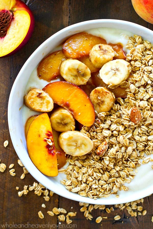 Ready for the ultimate power-packed summer breakfast? These granola yogurt bowls are piled high with warm caramel-y bananas and peaches and the EASIEST weekday breakfast ever!