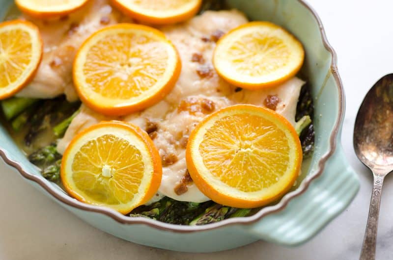 Fig & Orange Chicken Asparagus Bake is an easy and healthy one pot recipe with fresh and flavorful ingredients. Oranges, ginger and goat cheese compliment the tender chicken breasts and asparagus for a wholesome gluten-free meal you will love.