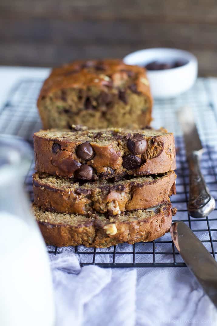 3 slices of Chocolate Chip Zucchini Bread stacked on a cooling rack