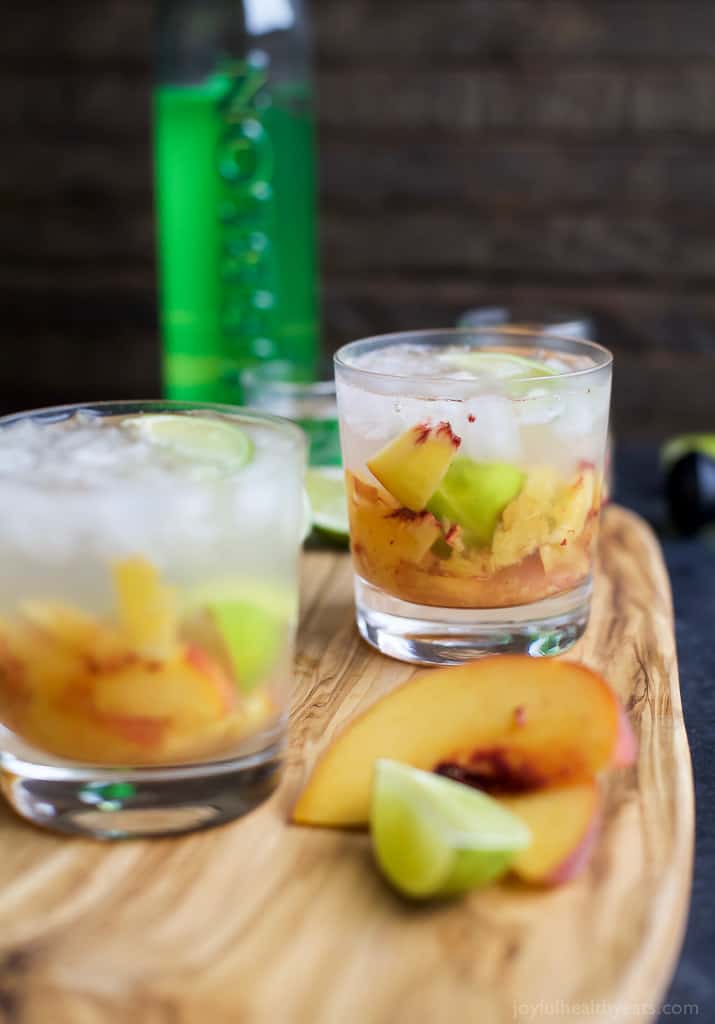 Brazilians know how to make a cocktail! Perfectly refreshing and easy to make - this Peach Caipirinha is hands my drink of choice! | joyfulhealthyeats.com