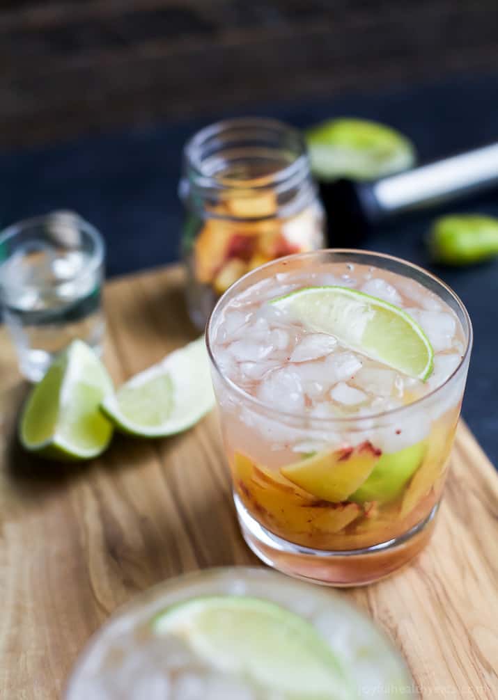 Brazilians know how to make a cocktail! Perfectly refreshing and easy to make - this Peach Caipirinha is hands my drink of choice! | joyfulhealthyeats.com