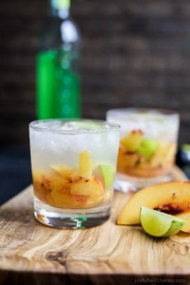 Brazilians know how to make a cocktail! Perfectly refreshing and easy to make - this Peach Caipirinha is hands my drink of choice! | joyfulhealthyeats.com