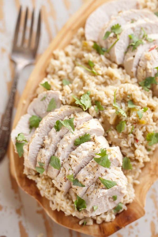 Pressure Cooker Turkey Verde & Rice is an easy 40 minute recipe made in your Instant Pot with only five ingredients! This healthy dinner idea is packed with bold flavor from salsa verde and full of wholesome brown rice and tender turkey tenderloins for a quick and delicious meal you will love.