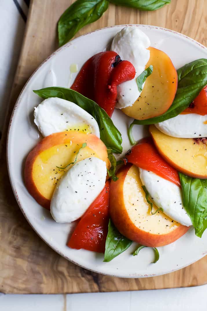 A light, refreshing, irresistible Roasted Red Pepper Peach Caprese drizzled with a homemade Balsamic Reduction. It's like a flavor bomb went off in your mouth! | joyfulhealthyeats.com #glutenfree #vegetarian