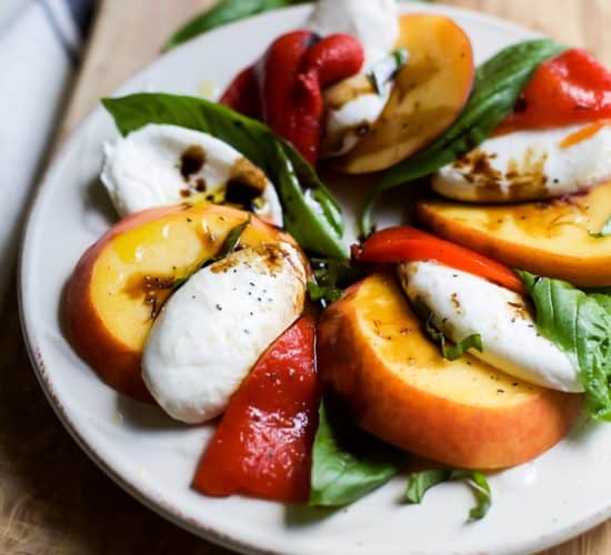 A light, refreshing, irresistible Roasted Red Pepper Peach Caprese drizzled with a homemade Balsamic Reduction. It's like a flavor bomb went off in your mouth! | joyfulhealthyeats.com #glutenfree #vegetarian