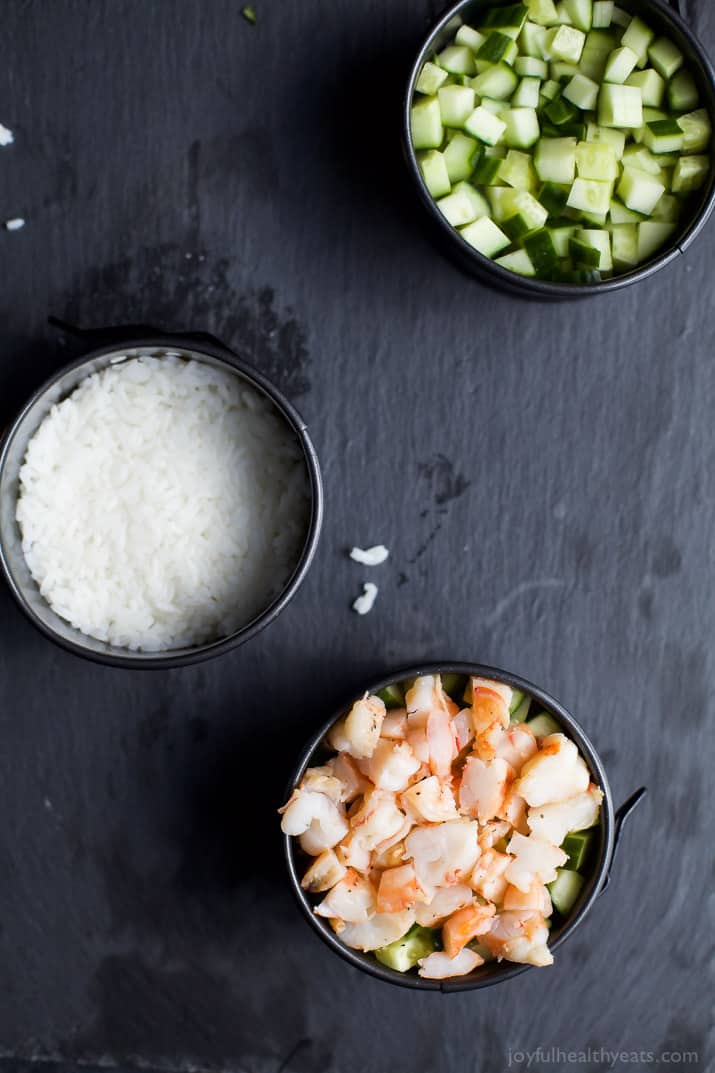 In the mood for Sushi but don't have the time? Problem solved with this easy healthy Stacked California Sushi Roll filled with shrimp, fresh cucumbers, and avocado. Sushi night just got better! | joyfulhealthyeats.com #glutenfree