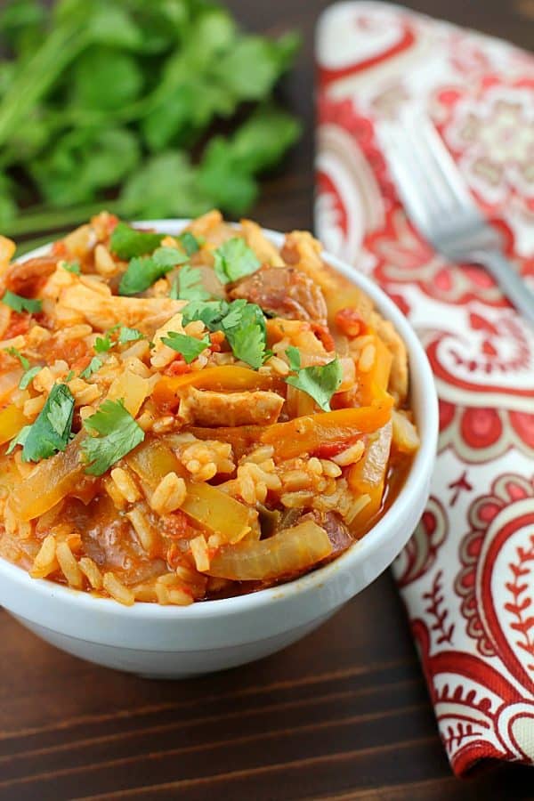 Chicken Jambalaya cooked in the slow cooker that’s low calorie, tastes great and fills you up! Using lean proteins, (sliced chicken breasts and turkey sausage) sliced up onions and bell peppers, and rice mix makes the recipe super easy. So tasty and with few ingredients!