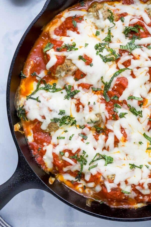 Overhead view of turkey meatballs baked in cast iron skillet