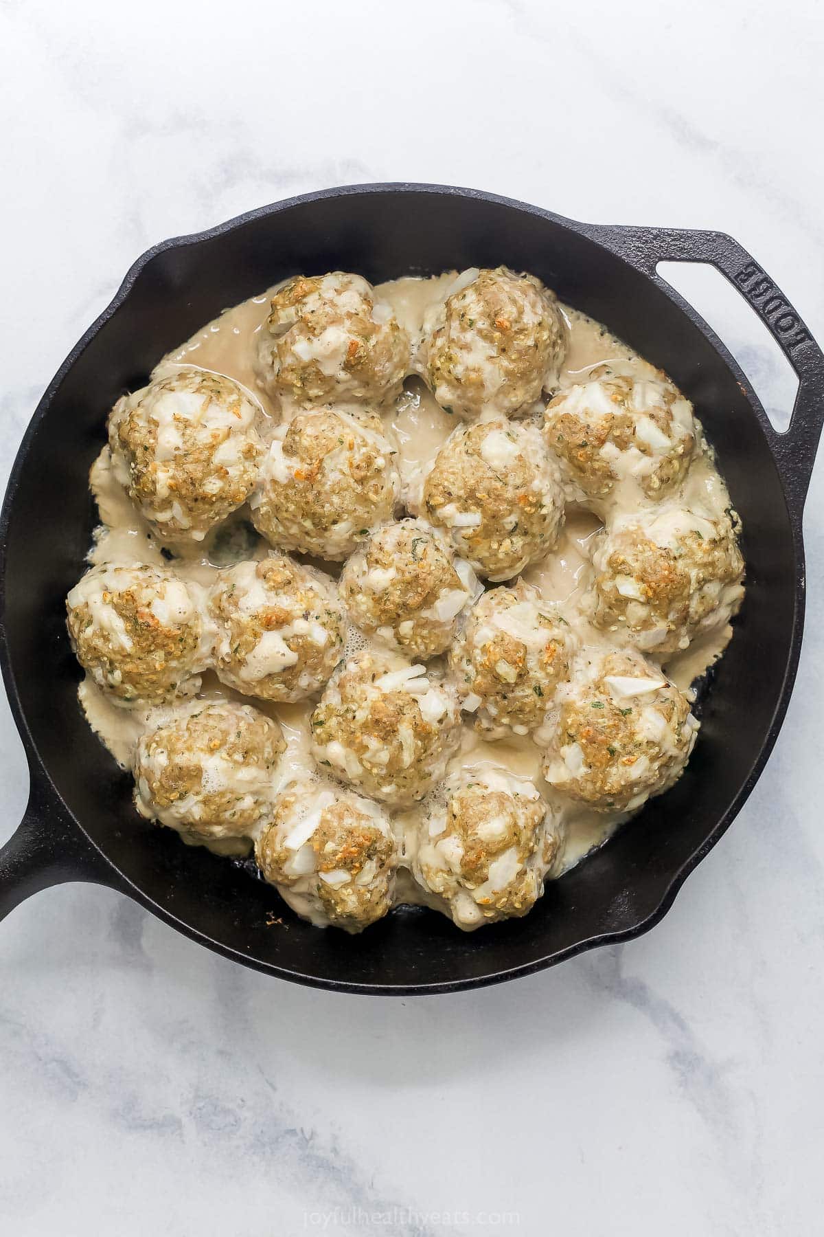 These Baked Turkey Meatballs are cooked in marinara to keep them flavorful and moist, and they’re also loaded with cheese. Done in 30 minutes! Baked turkey meatballs in skillet
