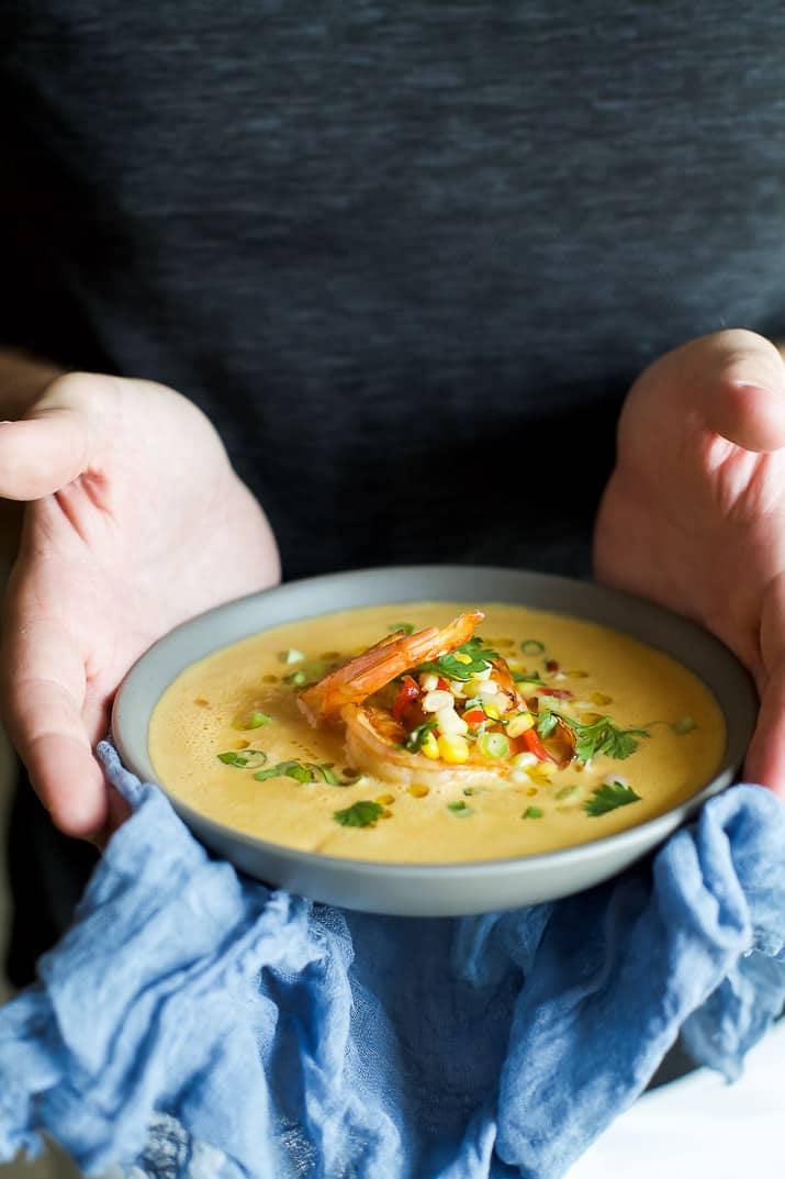 A bowl of Blender Corn Chowder with Pan Seared Shrimp and Corn Relish