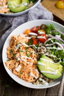 buffalo chicken quinoa in a bowl drizzled with ranch