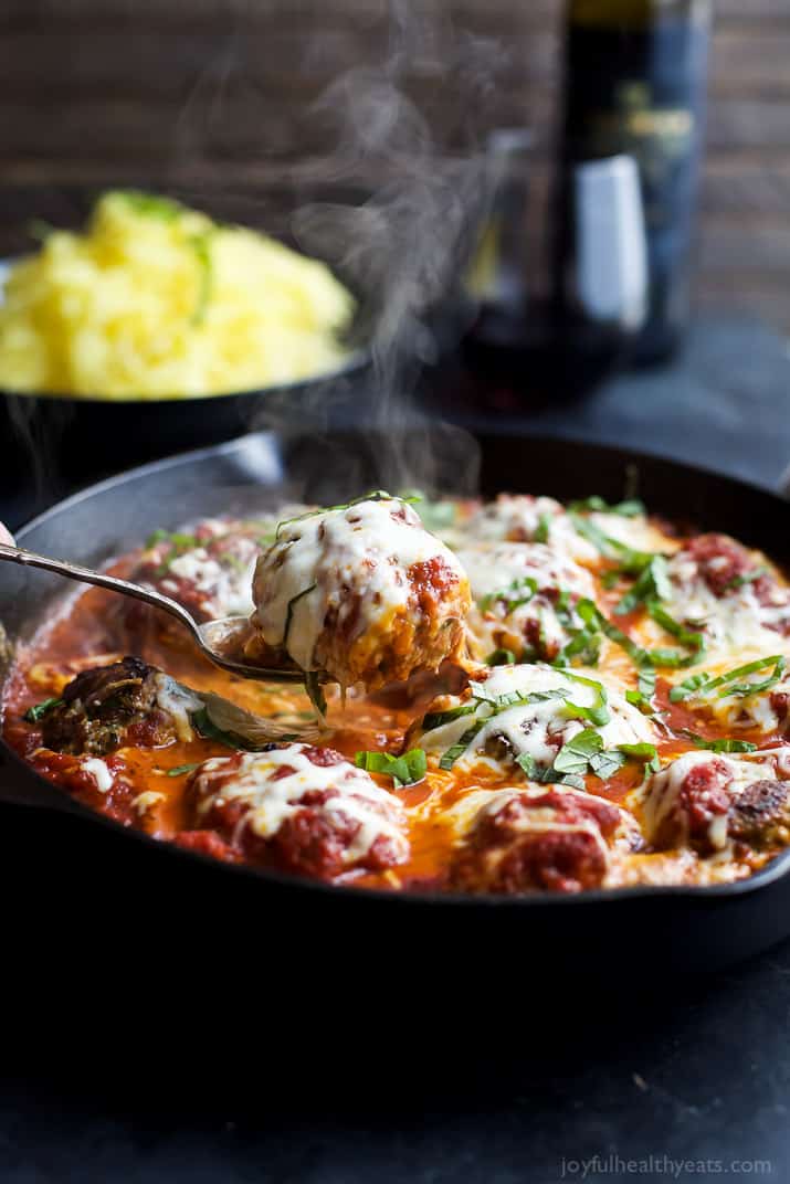 A pan of Cheesy Baked Turkey Meatballs cooked in Marinara sauce