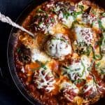 Cheesy Baked Turkey Meatballs cooked in Marinara sauce to keep them flavorful and moist. A comfort food that only takes 30 minutes to make! Holla! | joyfulhealthyeats.com
