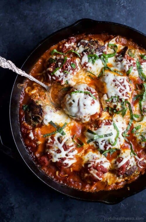 Cheesy Baked Turkey Meatballs cooked in Marinara sauce to keep them flavorful and moist. A comfort food that only takes 30 minutes to make! Holla! | joyfulhealthyeats.com