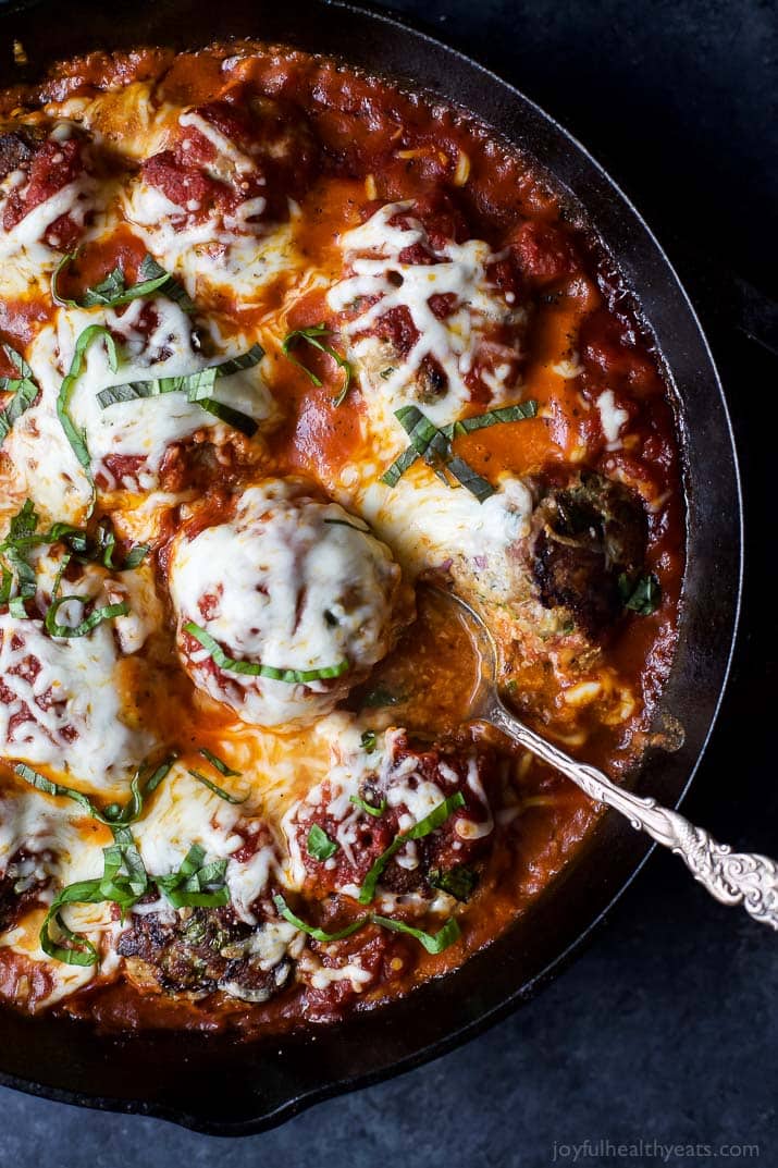 Top view of a pan of Cheesy Baked Turkey Meatballs cooked in Marinara Sauce