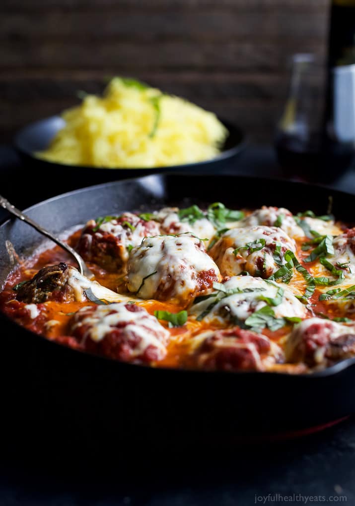 Cheesy Baked Turkey Meatballs cooked in Marinara sauce in a cast-iron skillet