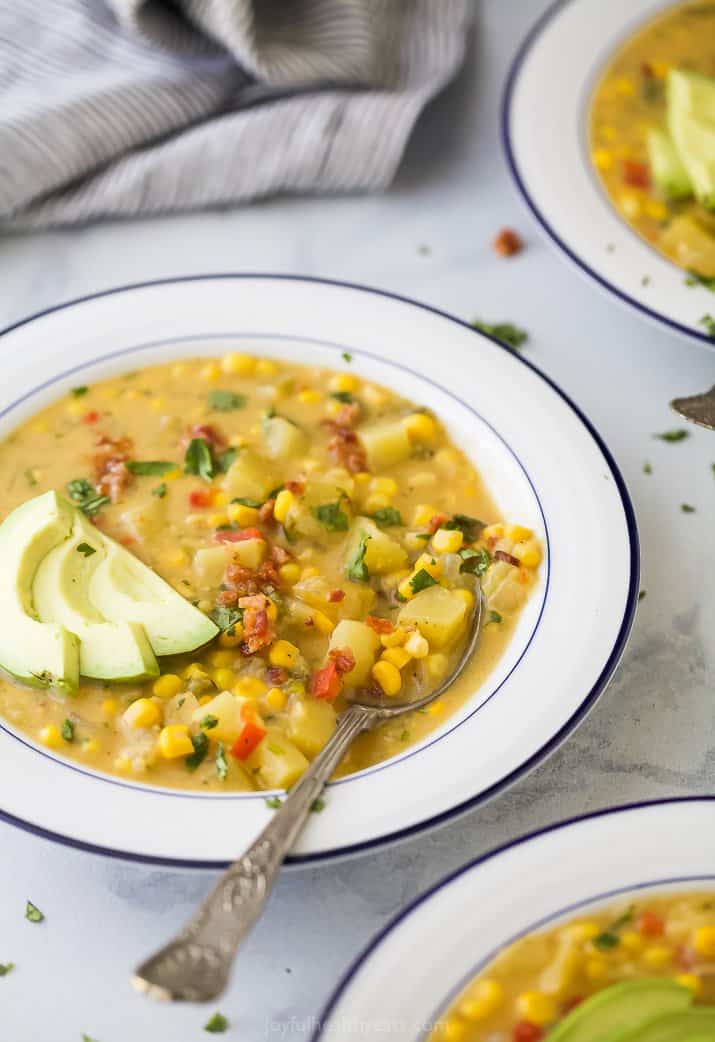 side view of a bowl filled with easy crock pot potato corn chowder