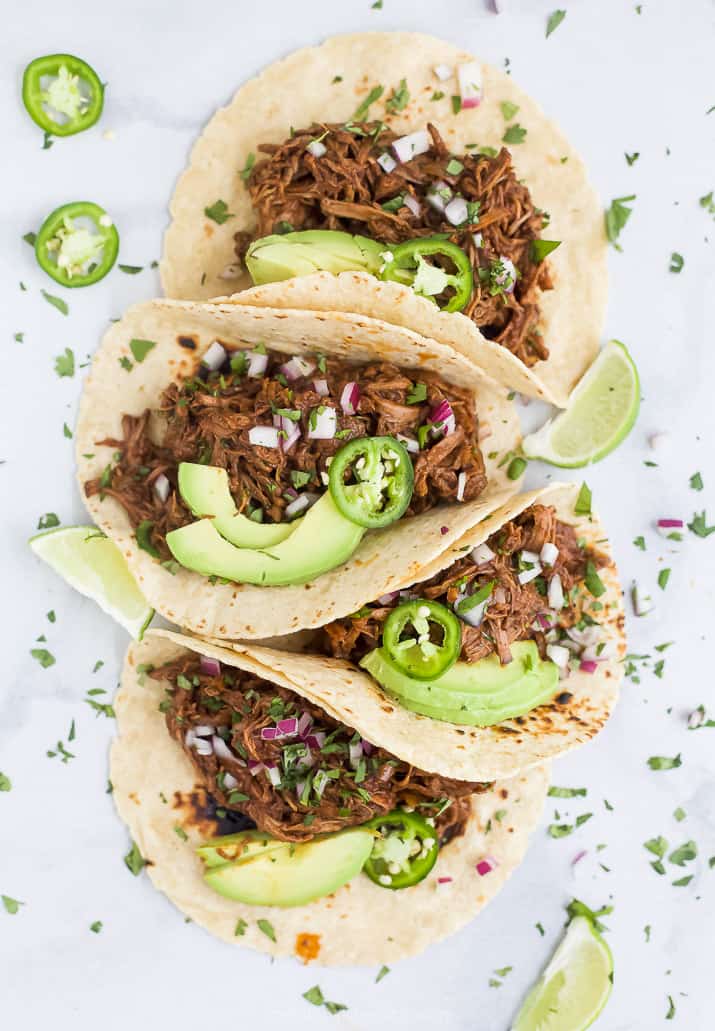 overhead photo of slow cooker barbacoa short rib tacos