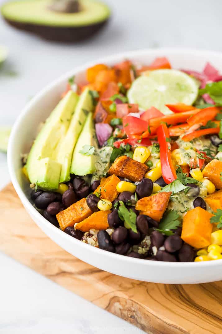 close up of easy sweet potato black bean quinoa bowls with crema