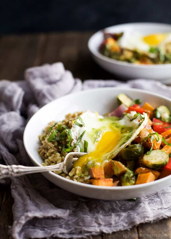 A Harvest Roasted Vegetable Grain Bowl topped with an egg