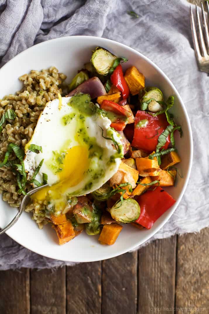 Top view of a Harvest Roasted Vegetable Grain Bowl topped with an egg