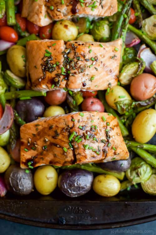 Sheet Pan Balsamic Salmon on a bed of potatoes, asparagus, and brussels sprouts! An easy healthy meal done in 30 minutes and full of bold flavors you’ll love!