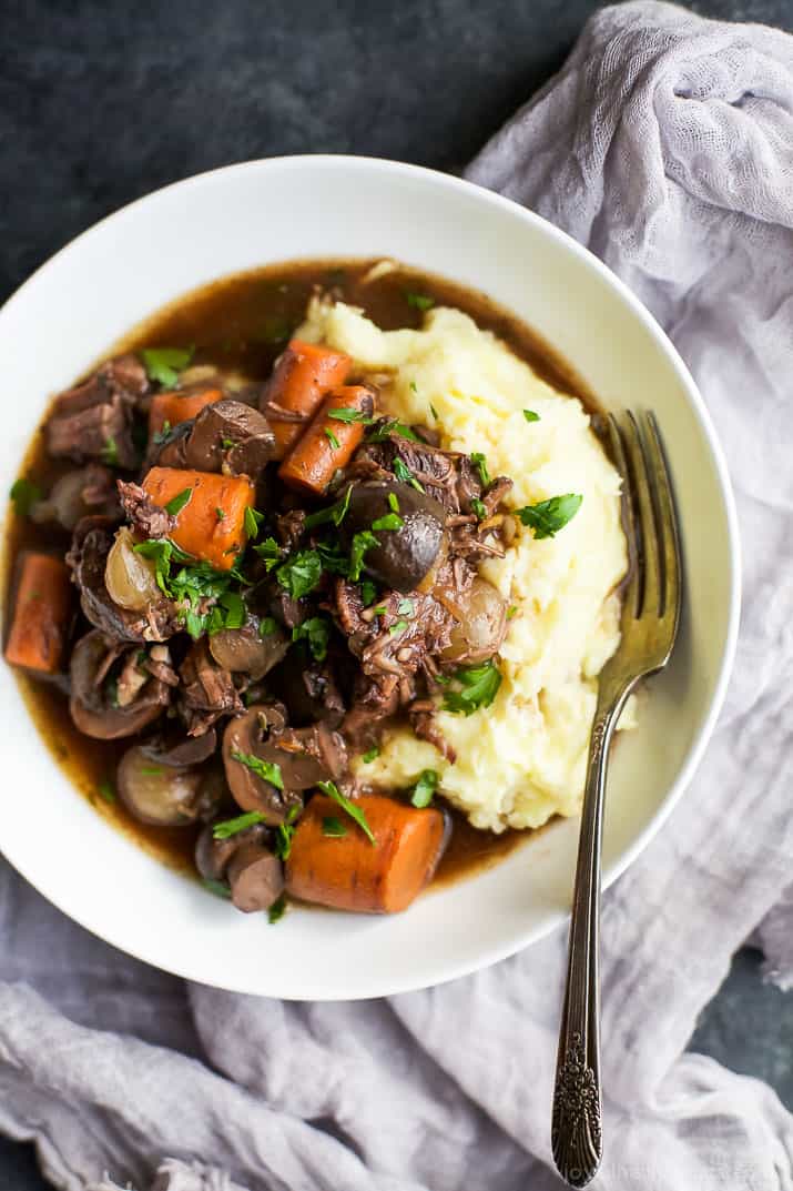 Channel your inner Julia Child with this easy Beef Bourguignon! A classic Beef Bourguignon recipe with a few tweaks but the kicker is this recipe is made in a slow cooker! | joyfulhealthyeats.com