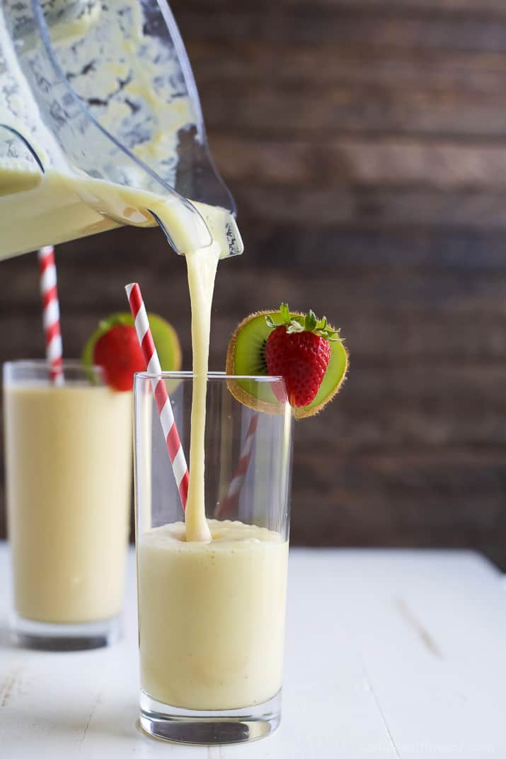 This refreshing Tropical Mango Smoothie is the perfect way to start your day. Fresh flavors that will take you straight to the beach and with 21 grams of protein! | joyfulhealthyeats.com | #drinkitallin #ad 