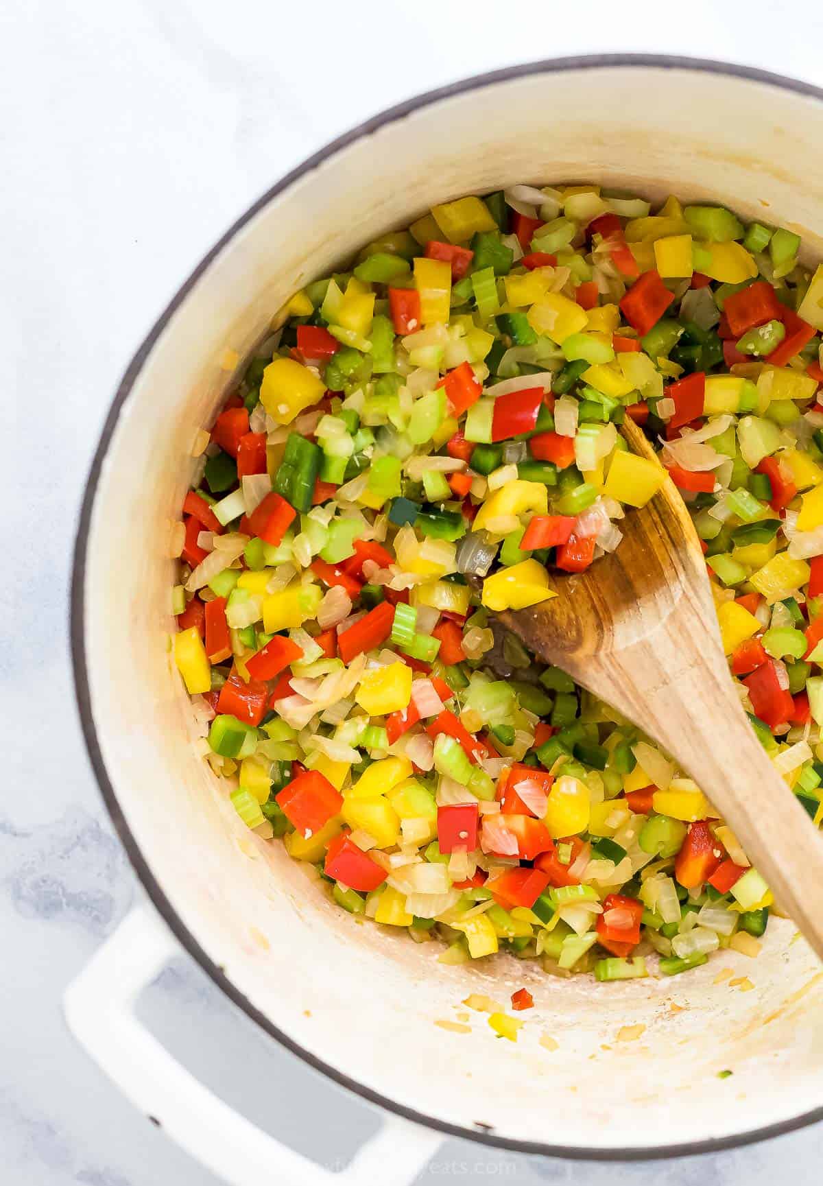 Sautéed onions, peppers, and celery in a dutch oven.