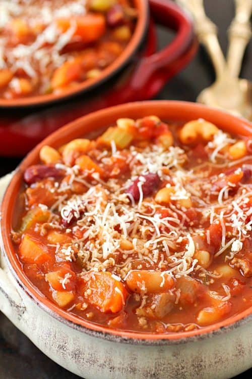 Pasta e Fagioli (which means pasta & beans in Italian) is a hearty & easy soup recipe full of beans, ground beef, a little bit of pasta and a lot of flavor! This Olive Garden copycat is a great dinner recipe for any night of the week!