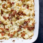 BACON CAULIFLOWER AU GRATIN, a creamy white cheddar cheese sauce tossed with cauliflower, fresh thyme and topped with bacon. A must have side dish for this holiday season that takes comfort food to a new level! | joyfulhealthyeats.com #RealFoodSunday #ad #glutenfree