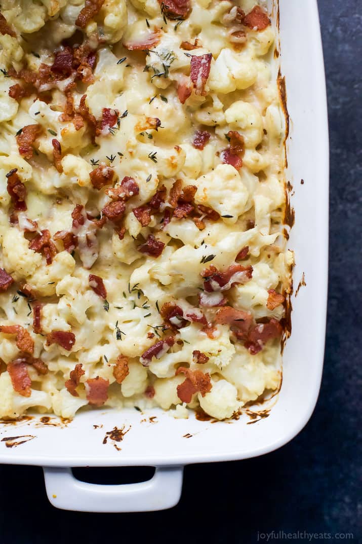 BACON CAULIFLOWER AU GRATIN, a creamy white cheddar cheese sauce tossed with cauliflower, fresh thyme and topped with bacon. A must have side dish for this ،liday season that takes comfort food to a new level! | joyfulhealthyeats.com #RealFoodSunday #ad #glutenfree