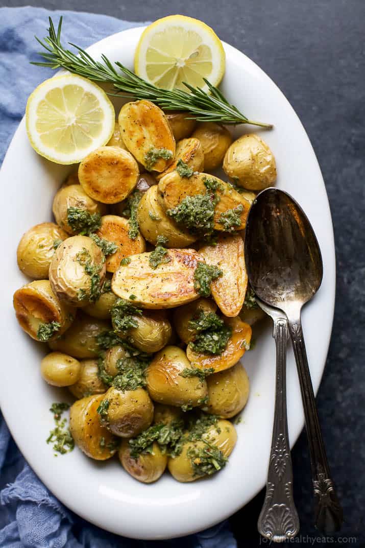 Top view of Oven Roasted Potatoes with herbs in a serving bowl 