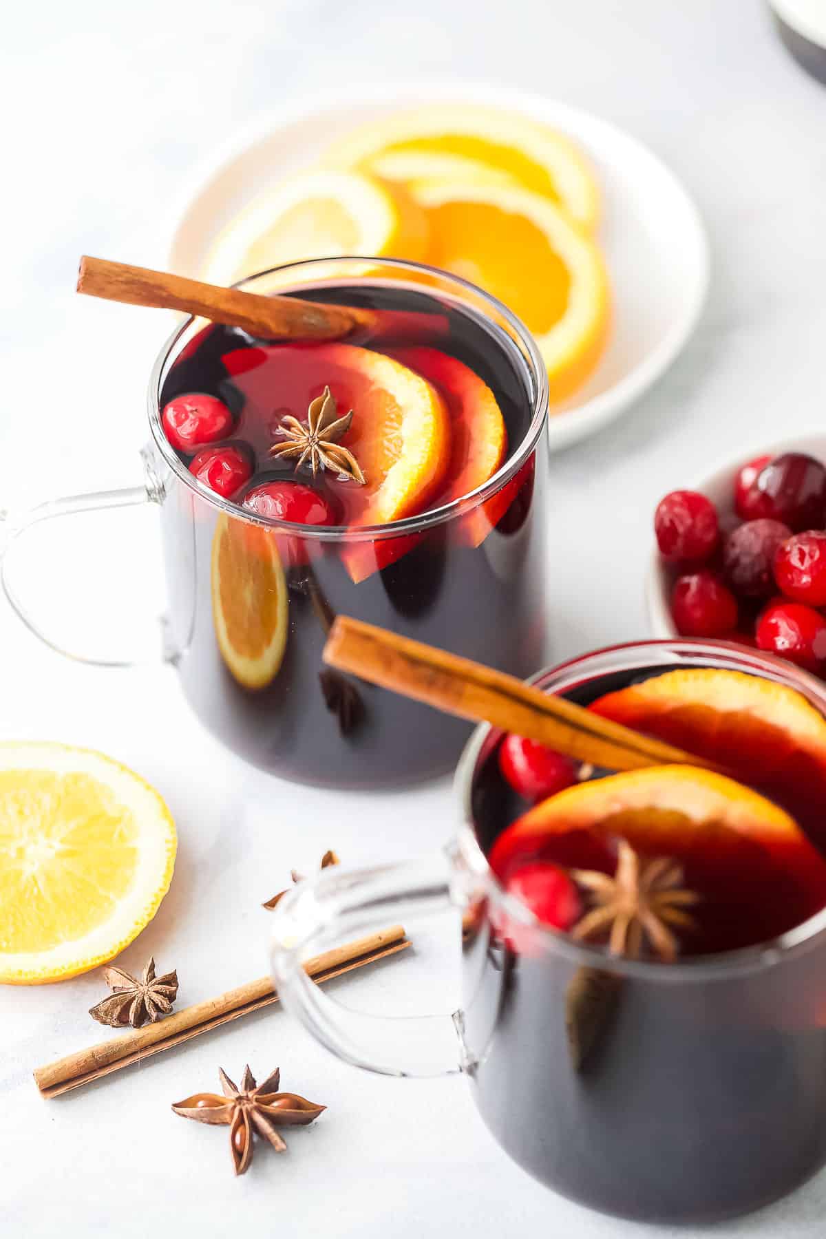 Warm cocktail with sliced oranges and cinnamon. 