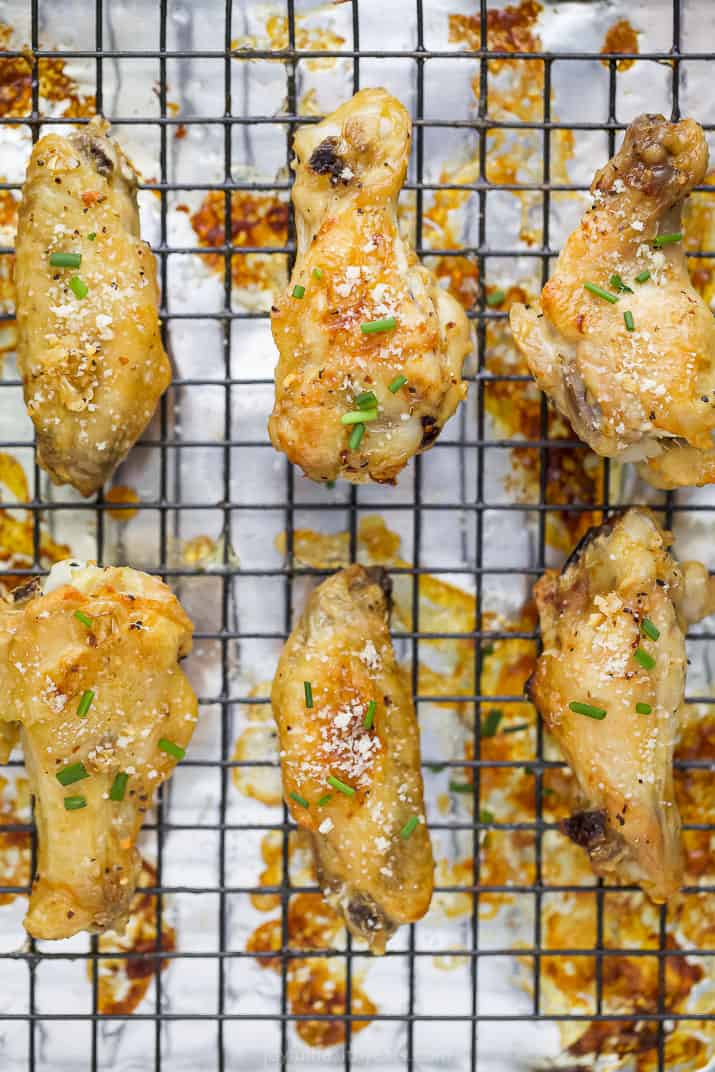 finished crispy baked garlic parmesan chicken wings on a cooling rack