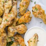 a pile of crispy baked garlic parmesan chicken wings