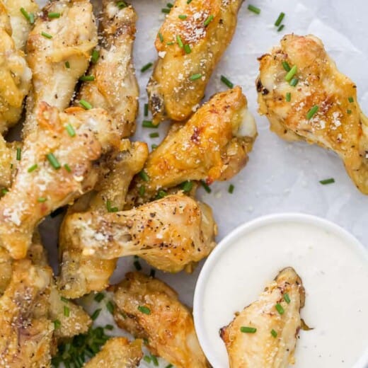 a pile of crispy baked garlic parmesan chicken wings