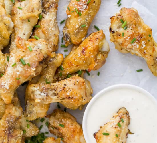 a pile of crispy baked garlic parmesan chicken wings