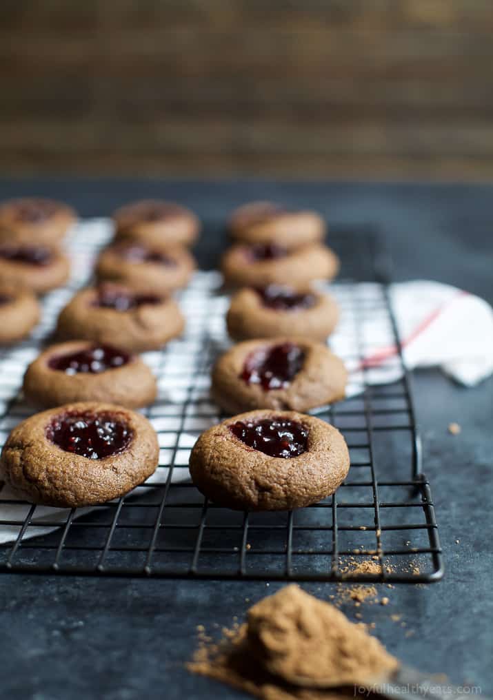 Chocolate Raspberry Thumbprint Cookies on a cooling rack