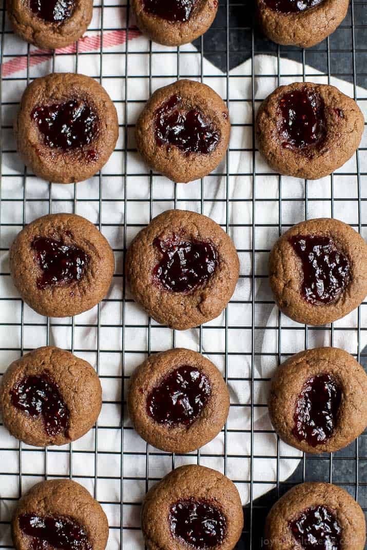 Top view of Chocolate Raspberry Thumbprint Cookies on a cooling rack