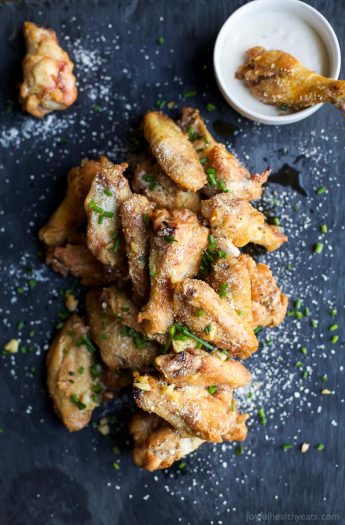 CRISPY GARLIC PARMESAN CHICKEN WINGS - baked instead of fried but these classic chicken wings are still as crispy and delicious as ever! The perfect party appetizer or game day treat! | joyfulhealthyeats.com | Gluten Free Recipes