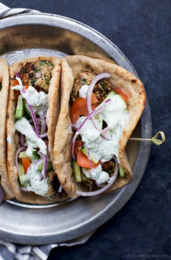 30 Minute Greek Turkey Meatball Gyros topped with a classic Tzatziki Sauce you'll want to swim in! These Gyros are the perfect healthy dinner option for the family and clock in 429 calories! | joyfulhealthyeats.com