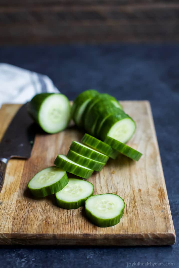 Fresh Simple Cucumber Bites topped with a zesty Herb Cream Cheese and sweet Piquillo Peppers. The perfect refreshing appetizer recipe for your next party! | joyfulhealthyeats.com #glutenfree #vegetarian